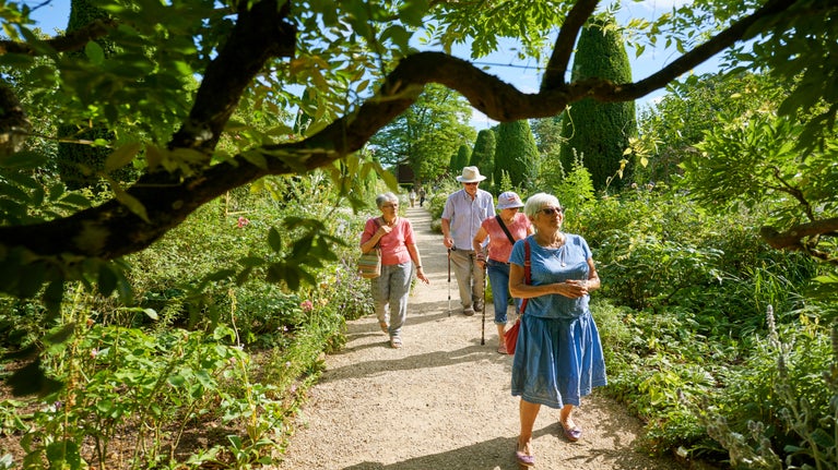 A group enjoying the Long Borders at Hidcote